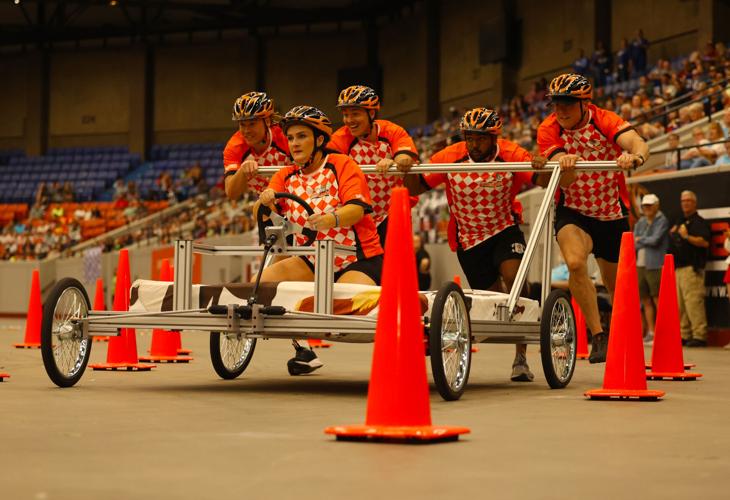Team goes through cones at Bed Races.JPG