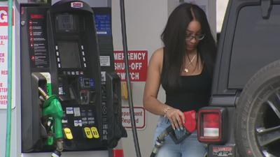 Woman at gas pump