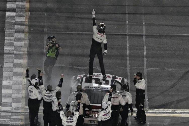 Austin Cindric celebrates on top of his car after winning the NASCAR Daytona 500.jpeg