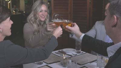 People raise drinks