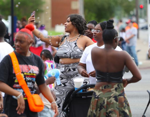 Women pose for selfie at parade.JPG