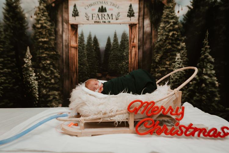 NICU baby in holiday outfit at Baptis Health Floyd