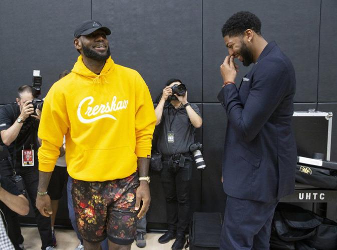 LeBron James, left, shares a moment with Anthony Davis