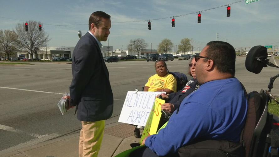 Close to one dozen people gathered to protest TARC Monday, April 8, 2024. (WDRB image)