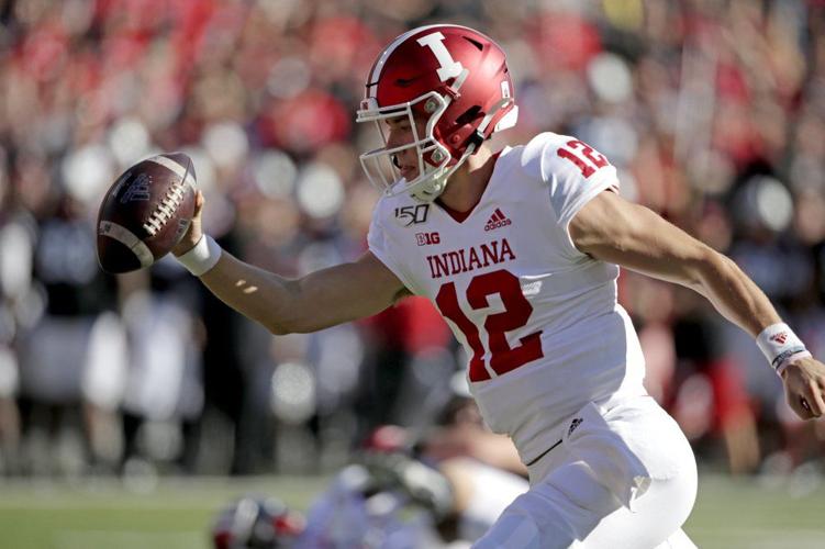 Indiana quarterback Peyton Ramsey (12) reaches with the ball