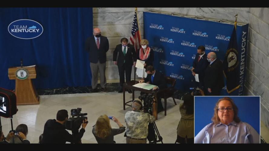 Kentucky Gov. Andy Beshear signs bi-partisan election reform bill on April 7, 2021