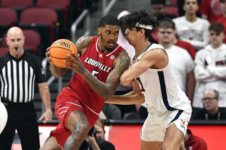 Louisville forward Malik Williams drives to the basket against Virginia.jpeg