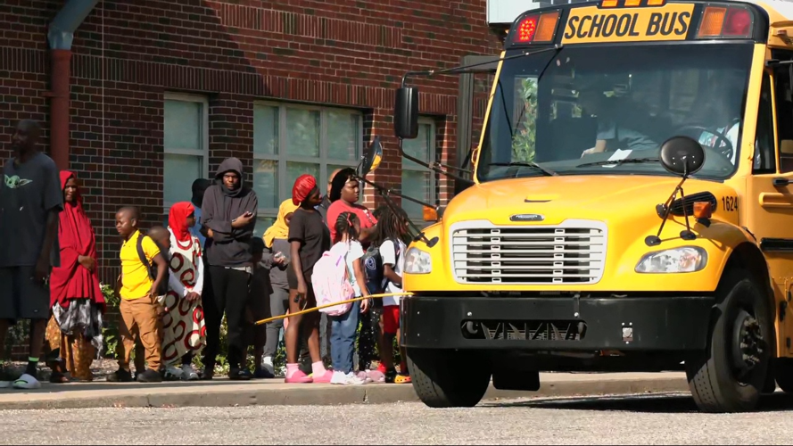Students near JCPS bus at Cochrane Elementary