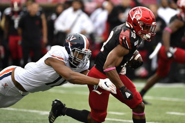 Louisville running back Javian Hawkins (10) is brought down by Virginia linebacker Charles Snowden