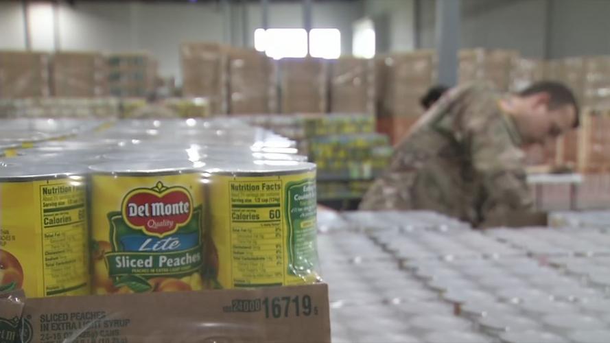 Ky. Guard Member behind cans at Dare to Care