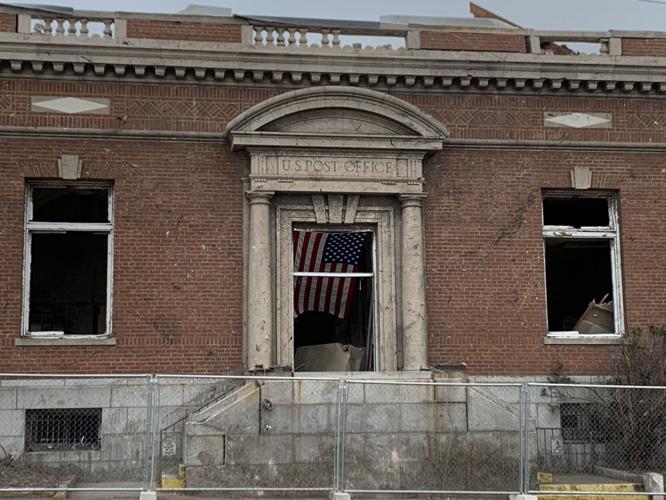 MAYFIELD TORNADO - Flag in the door of the Post Office - 12-15-2021 1.jfif