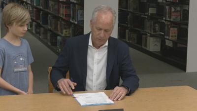 Mayor Greg Fischer signs ordinance.jpeg