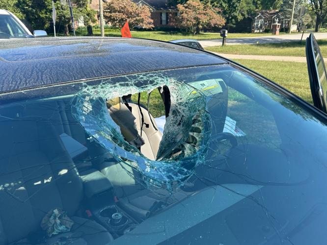 METAL SMASHES THROUGH CAR.jpg