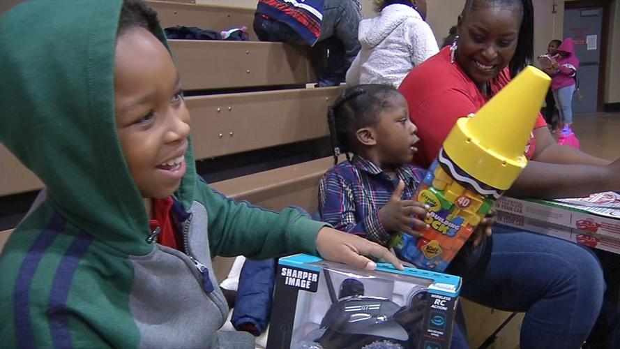 Santa visits hundreds of children at community event in Park Hill neighborhood