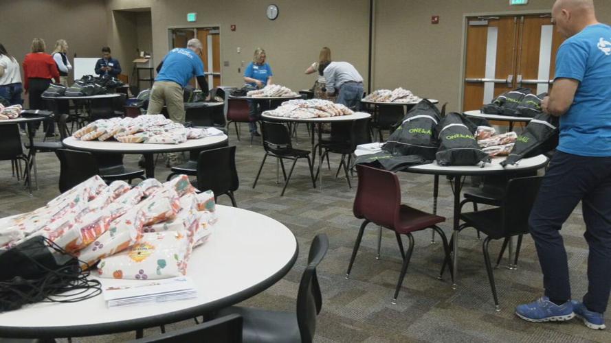 Duke Energy volunteer pack bags for Blessings in a Backpack