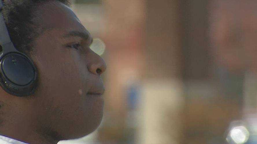 Performing 'Hamilton' hits, Male High School grad turns street into stage