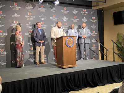 Beshear with Ed Brown Society founders at Churchill Downs