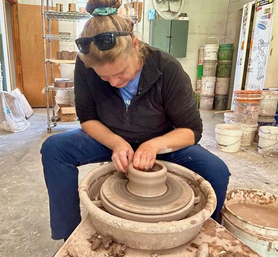 Trish Caudill works on pottery.jpg