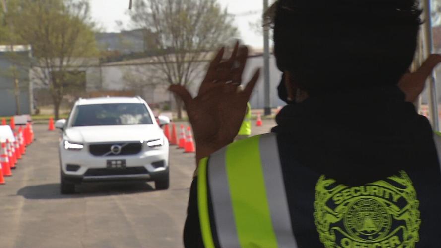 Car in line for COVID-19 vaccination at Cardinal Stadium