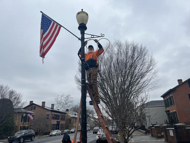 Madison, Ind. city crews install Valentine's Day displays on city light poles