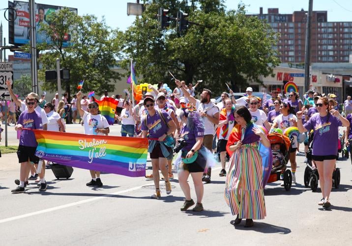 People turn onto Preston Street at Kentuckiana Pride Parade