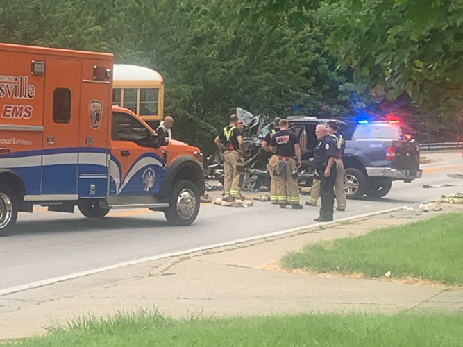 First responders near truck involved in crash with JCPS bus on Newburg Road in Louisville