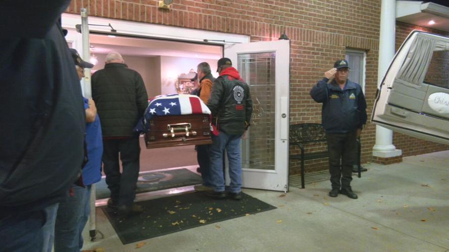 Vets carry remains of Private First Class Charles Well into Chism Family Funeral Home