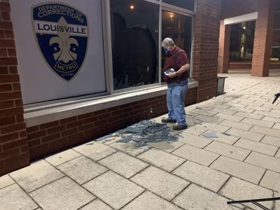 Shattered glass outside Metro Corrections after protests