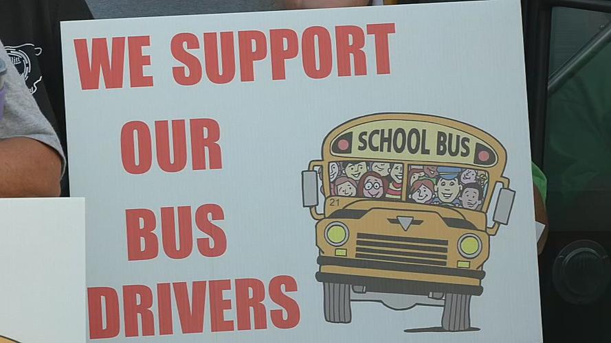 We support our bus drivers sign.png