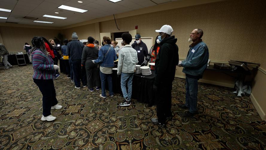 People wait for breakfast at Wayside Christian Mission in Louisville