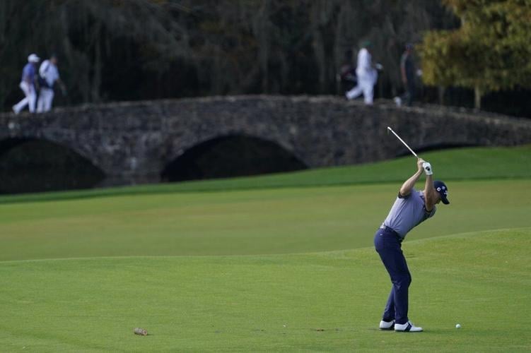 Justin Thomas hits on the 12th hole during the second round of the Masters golf tournament Friday