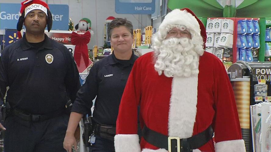 Metro Police Officers surprise Walmart shoppers with gift cards