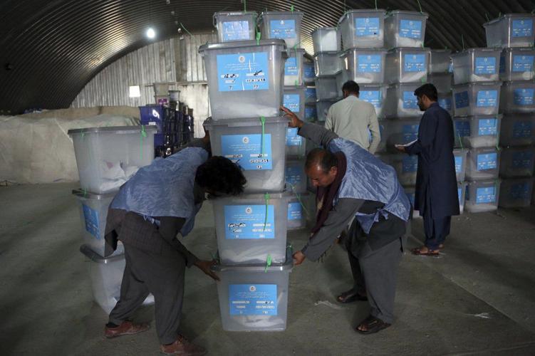 Afghan Election Workers Clean Up 9-29-19 AP.jpeg