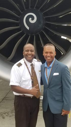 Captain Wellington smiles alongside UPS VP of Flight Operations