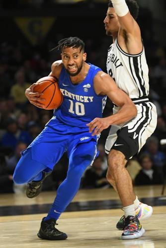Kentucky guard Davion Mintz tries to get around a Vanderbilt defender.jpeg