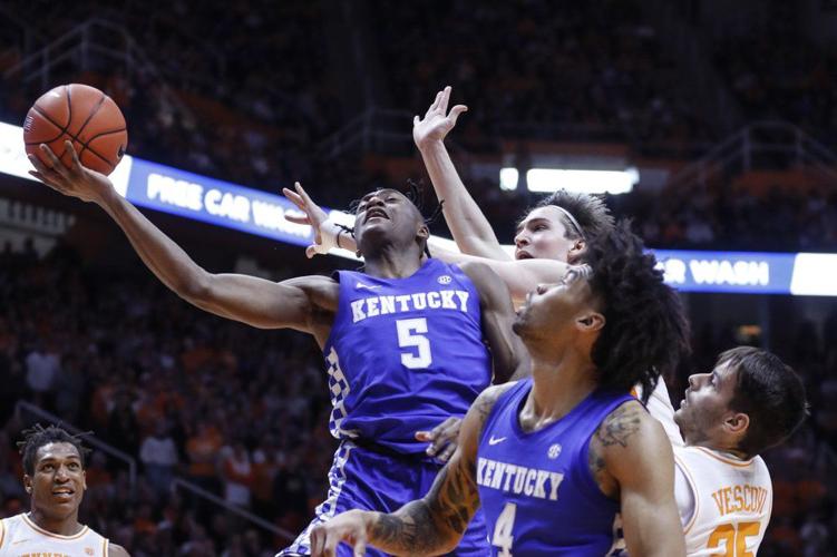 Kentucky guard Immanuel Quickley (5) shoots past Tennessee forward John Fulkerson
