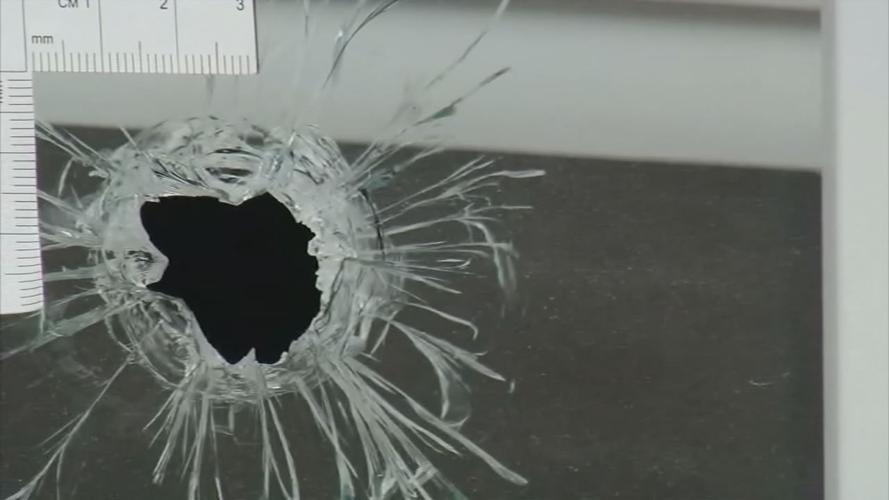 BREONNA TAYLOR'S APARTMENT - bullet hole in window  - 1  (3).jpg