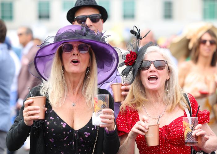 Women cheer for horses during race.JPG