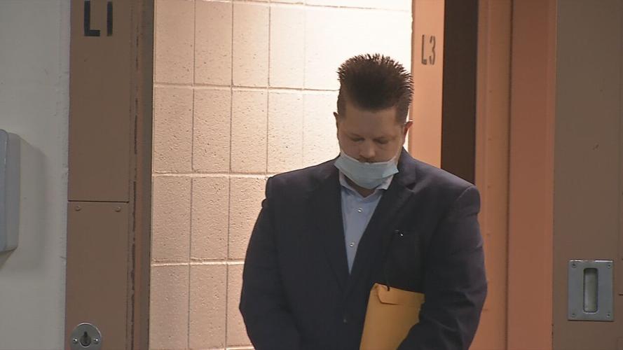 Oberhansley enters doorway at second trial