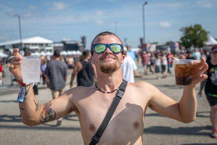 A fan enjoys some hydration at the Louder Than Life Festival on September, 21, 2025 in Louisville, Kentucky (75 of 175).jpg