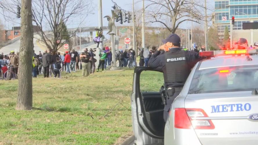 Protesters march through Louisville, Ky., on Saturday, March 13, 2021