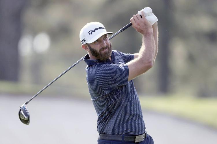 Dustin Johnson tees off on the third hole during the final round of the Masters