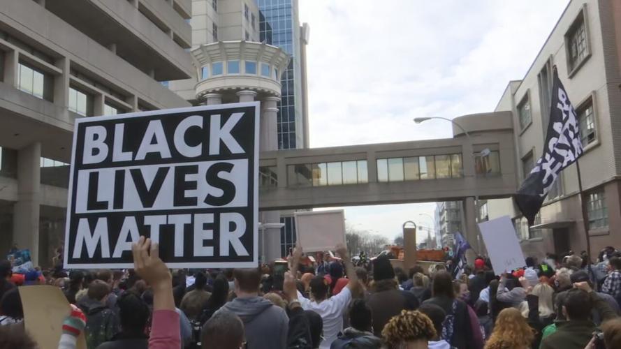 Protesters march through Louisville, Ky., on Saturday, March 13, 2021