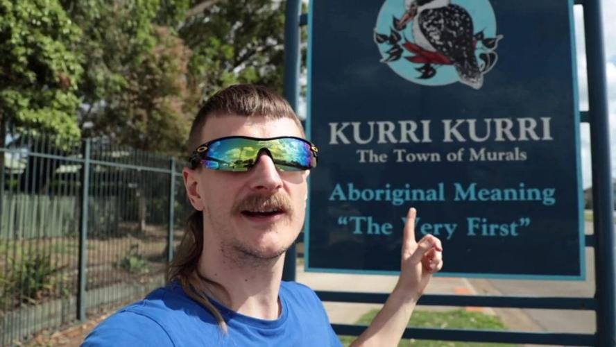 Rob Ayton in front of sign