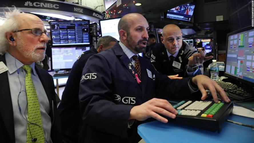 Stocks end December, year sharply lower, despite day's gains