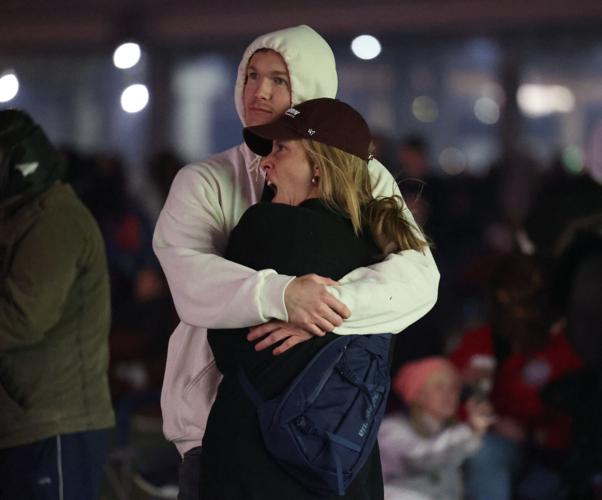 Couple hugs during Thunder Over Louisville.JPG