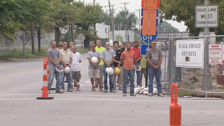 Construction workers pay homage as Louisville firefighters hold moment of silence to remember 9/11 victims