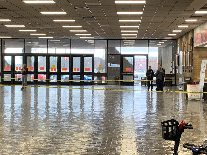 LMPD investigators inside crime tape after shooting at Kentucky Expo Center