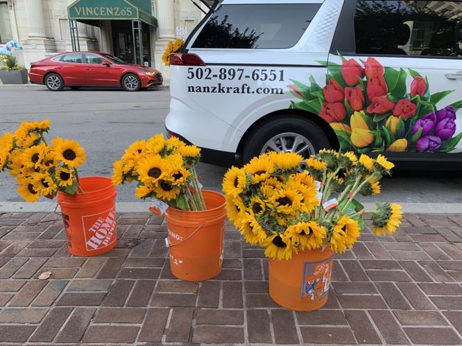 Local florist pays it forward by giving sunflowers away for free