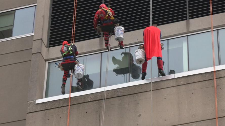 Window washers rappel from Norton Children's Hospital dressed as superheroes